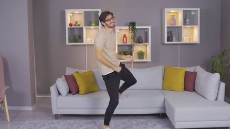 Happy-Young-Man-Dancing-In-Cozy-Home-Clothes.